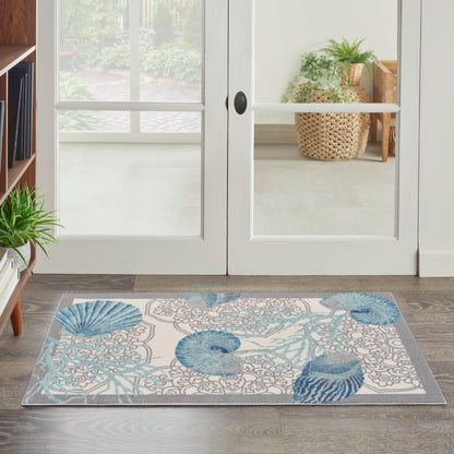 Waverly Sun &amp; Shade Shore Thing Teppich für drinnen und draußen, tropische Muscheln, Blumenmuster